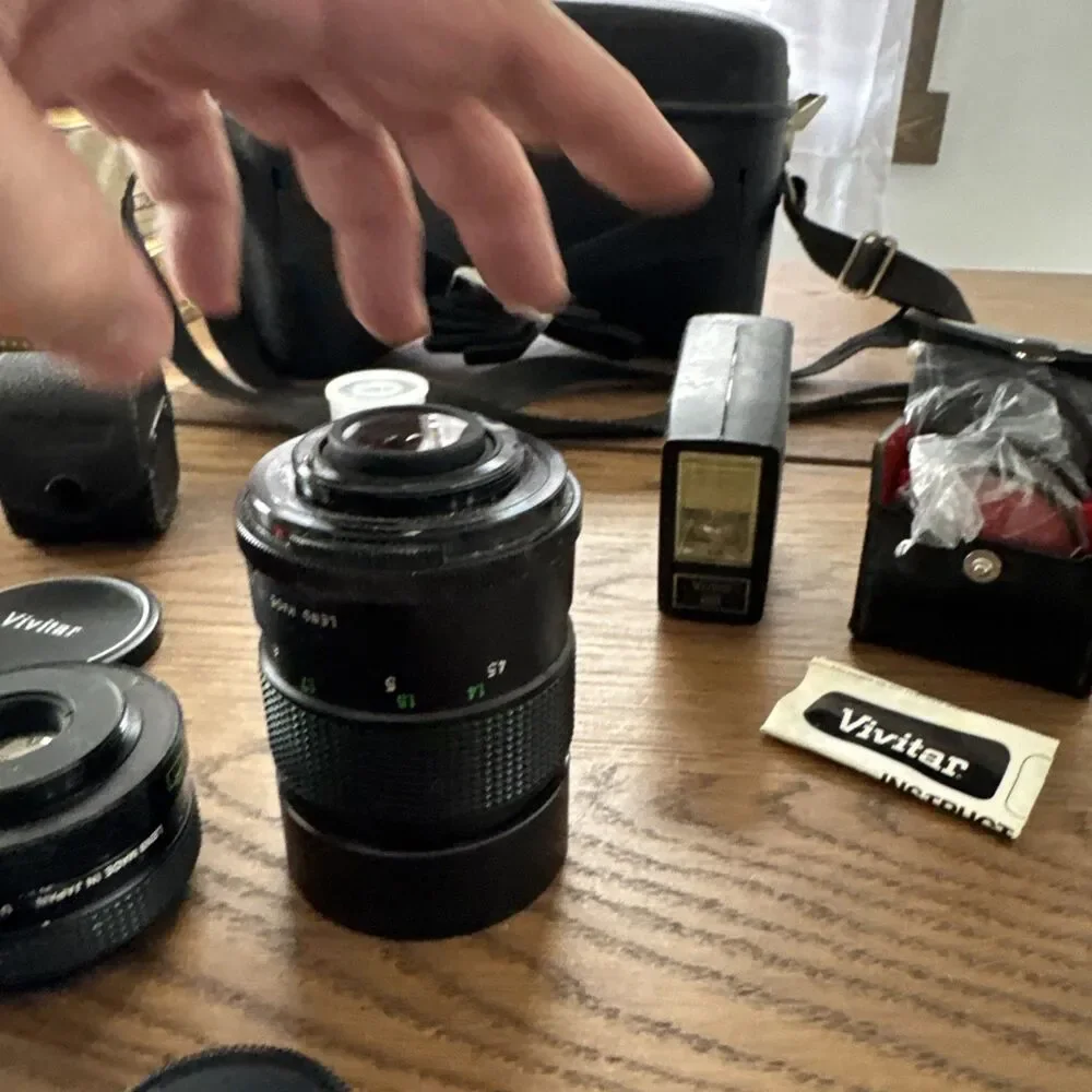 vintage Vivitar hard-sided black camera case And Vivitar camera accessory lot